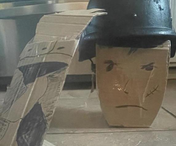 Carboard Soilder With Old Helmet