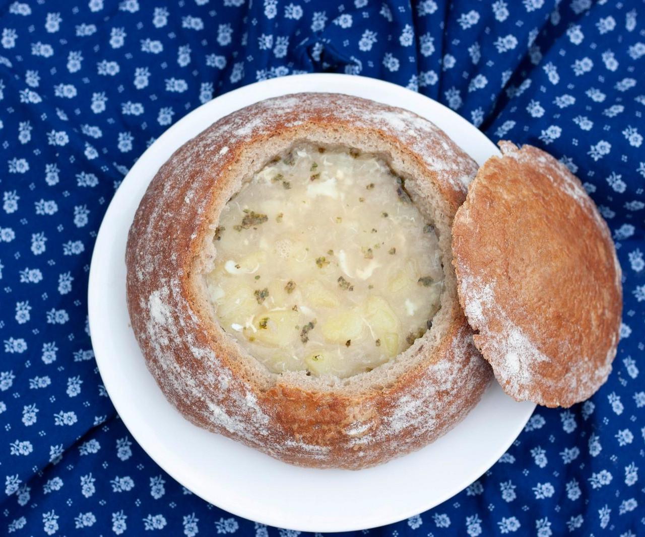 Traditional Czech Garlic Soup Served in Bread