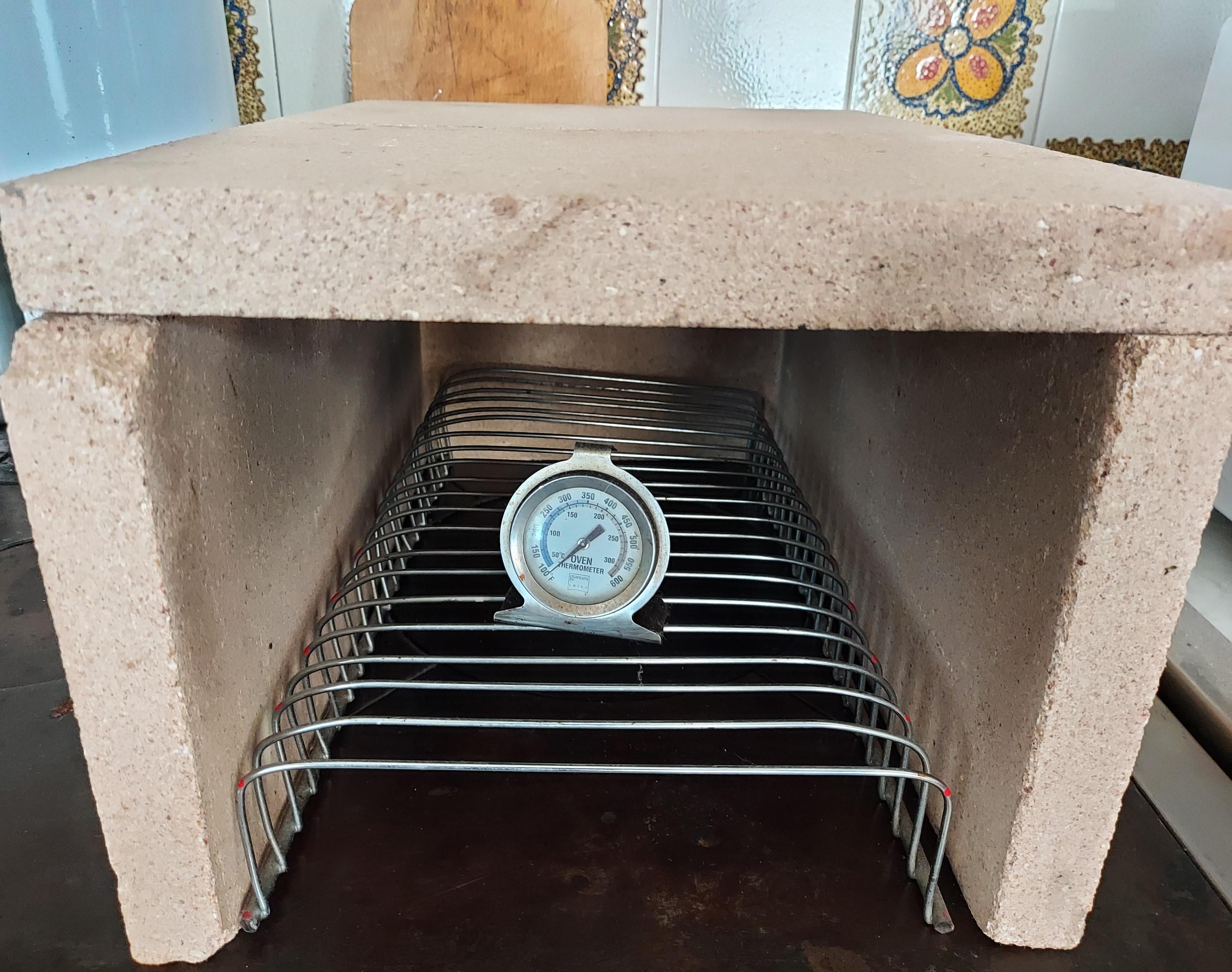 SMALL TEMPORARY OVEN ABOVE THE KITCHEN STOVE