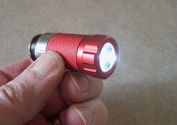 Charging an LED Flashlight in a New Auto Power Socket