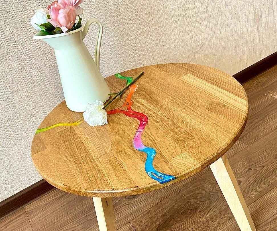 Rainbow River of Melted Crayons on Coffee Wooden Table