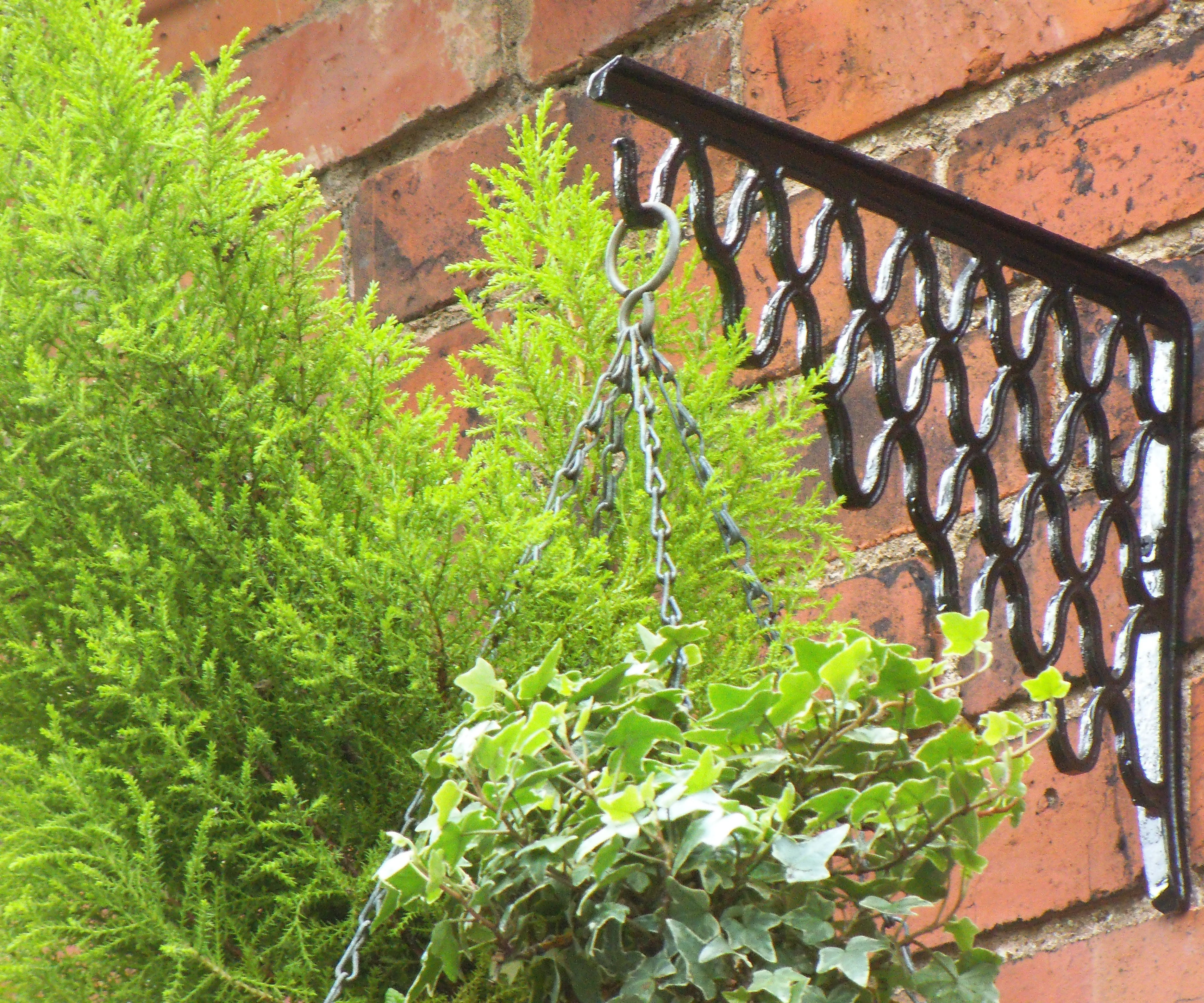 CAST IRON HANGING BASKET BRACKETS FROM OLD SEWING MACHINE TREADLE