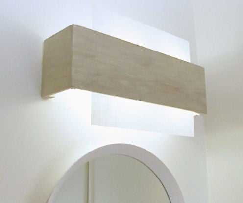 Camouflaging a Dated Off-center Bathroom Lighting Fixture 