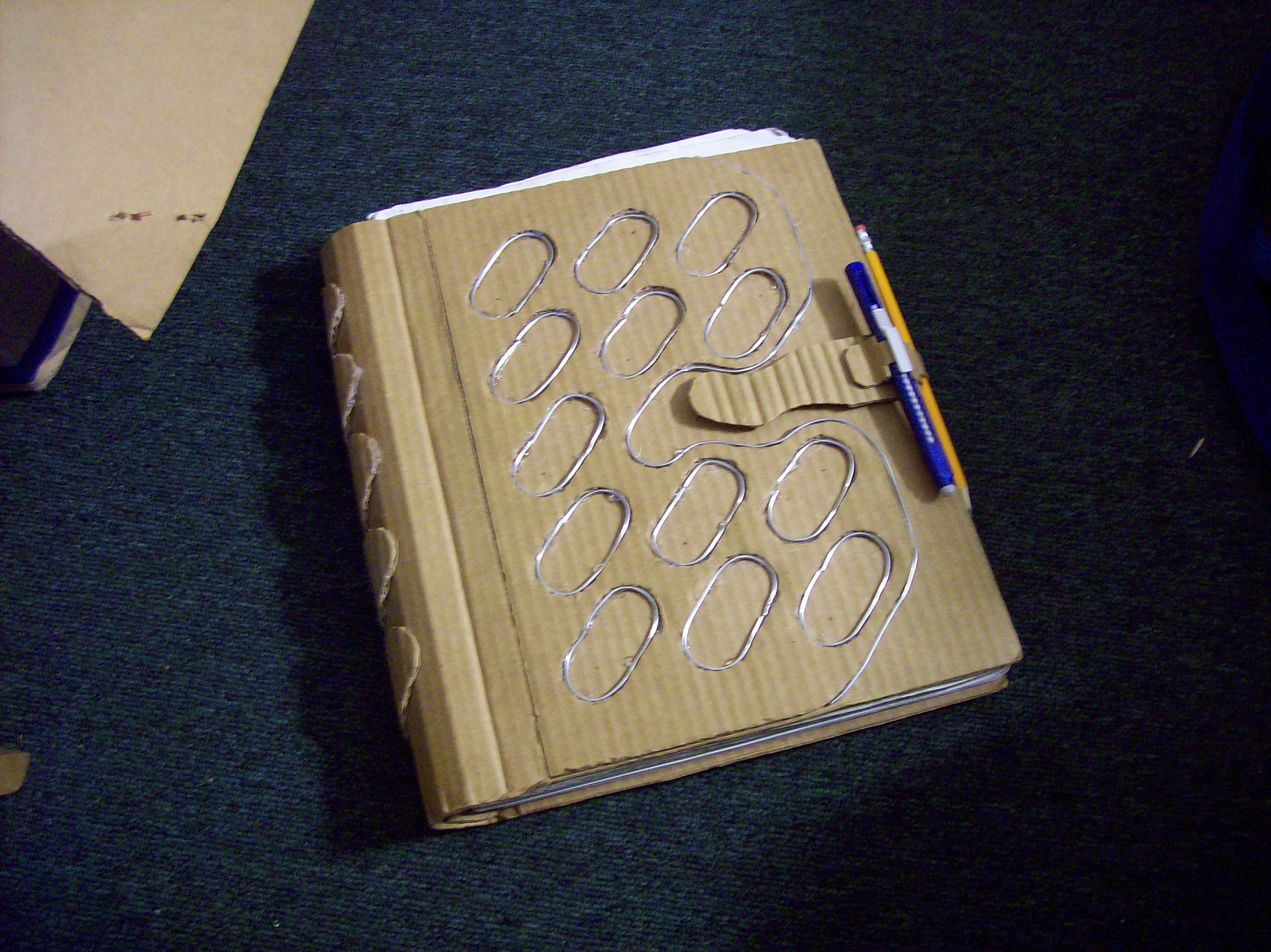 Rebinding a SketchBook Using Wasted Cardboard
