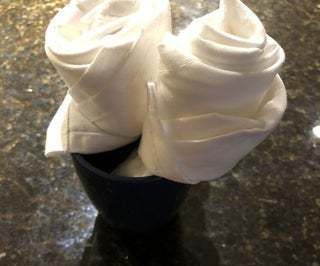 How to Fold a Cloth Napkin Into a Rose Shape