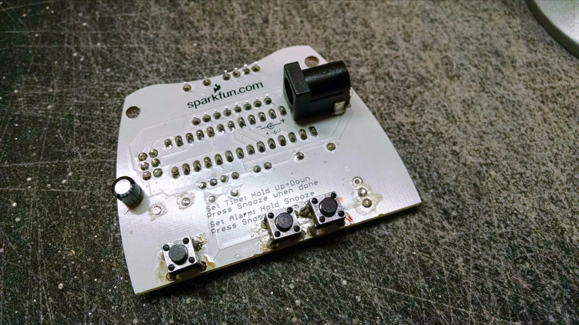 10 - I moved three buttons and a capacitor to the back of the board.jpg