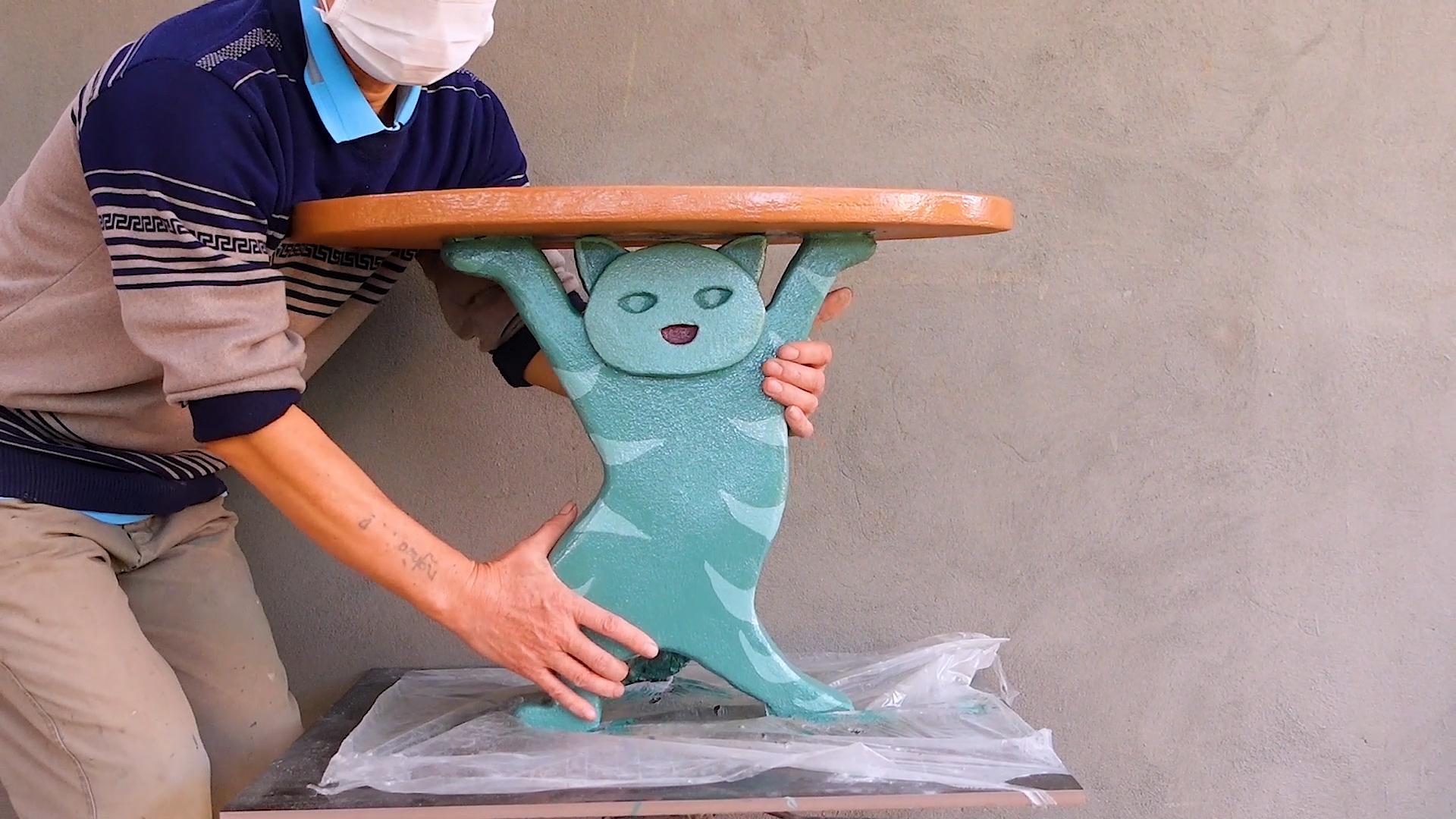 14. Amazing concrete cat shaped coffee table.00_04_33_18.Still028.jpg