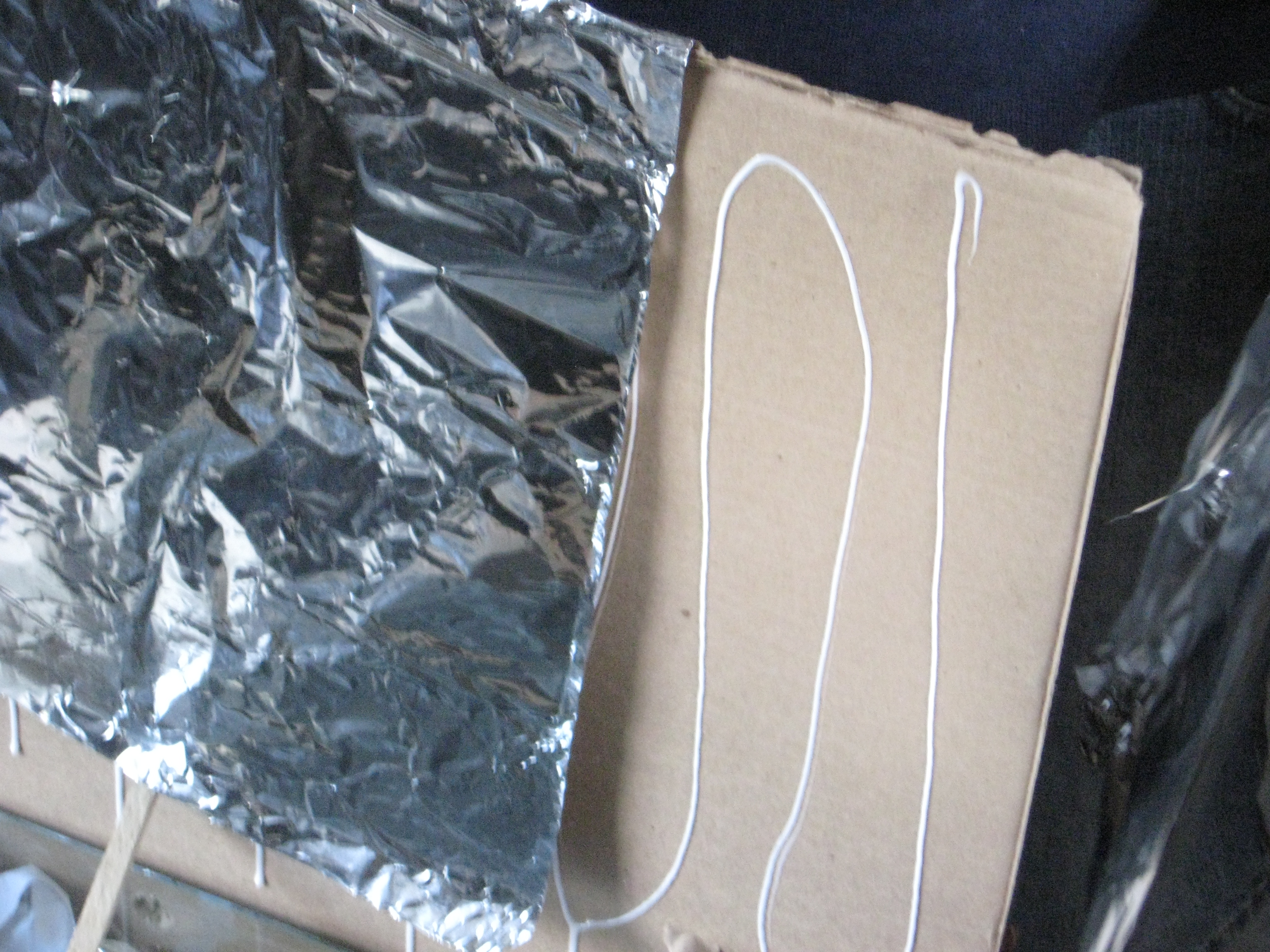 14putting aluminum foil on reflector.JPG