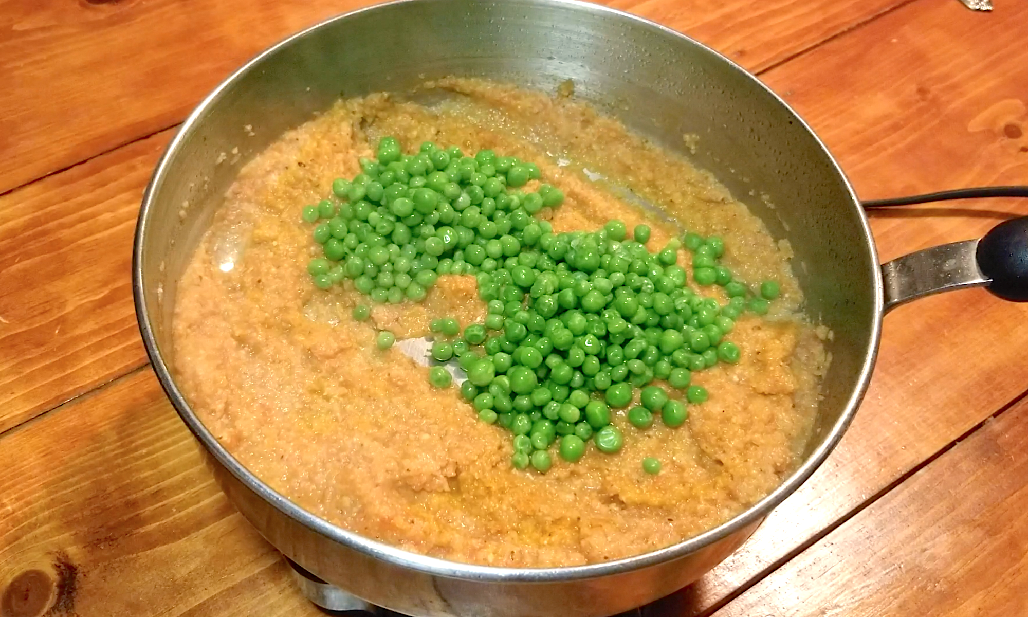 19-aloo-matar-add-peas-to-pot.png