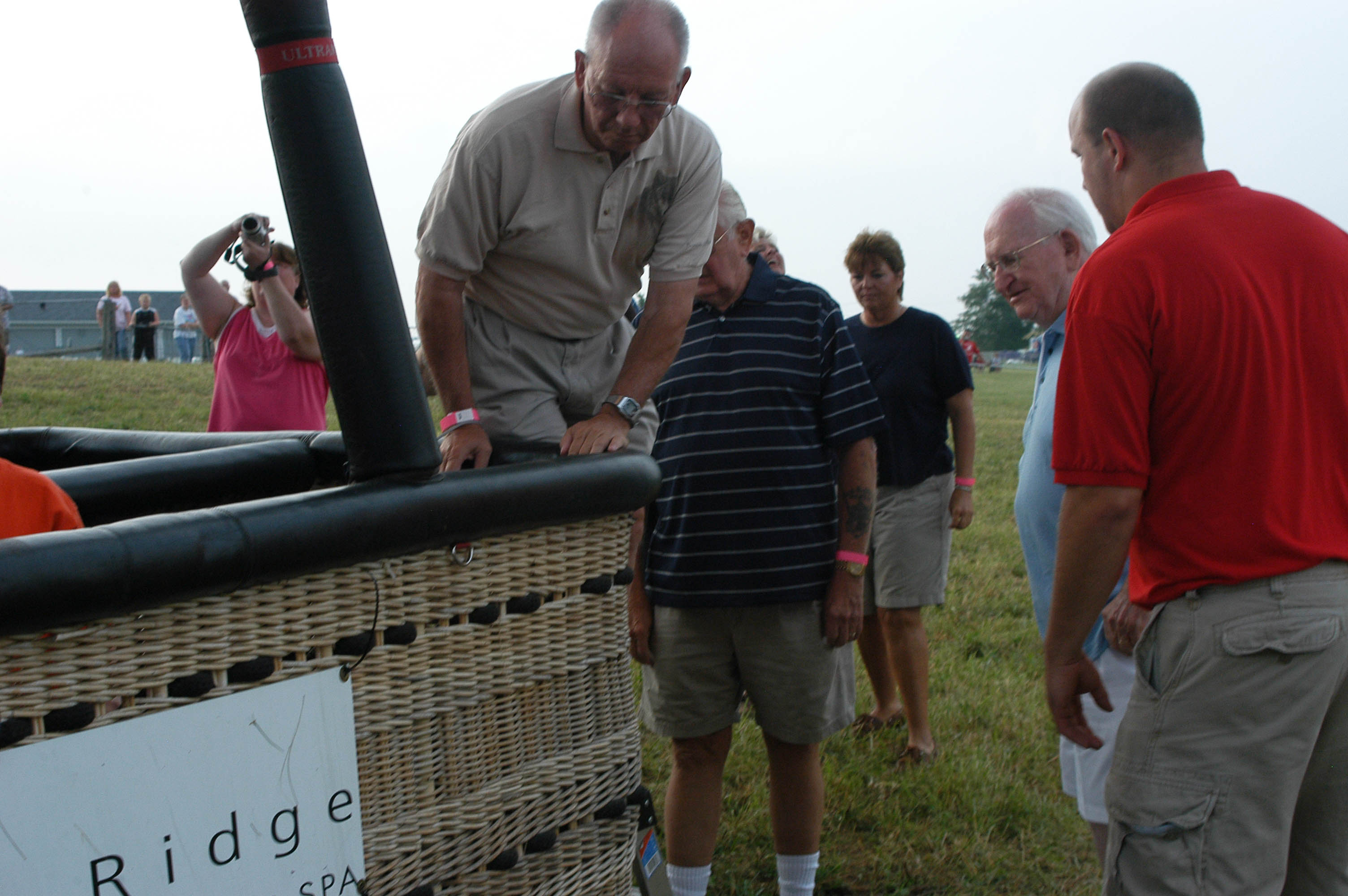 2. Climbing into basket.JPG