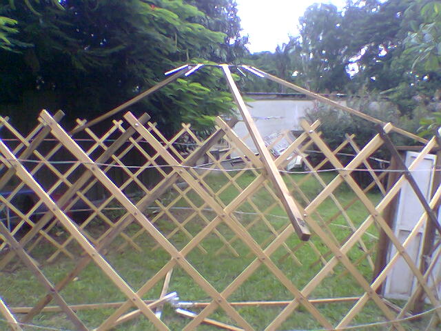 29-lift lower end of 3rd timber approximately into place. none are ontop of wall yet.jpg