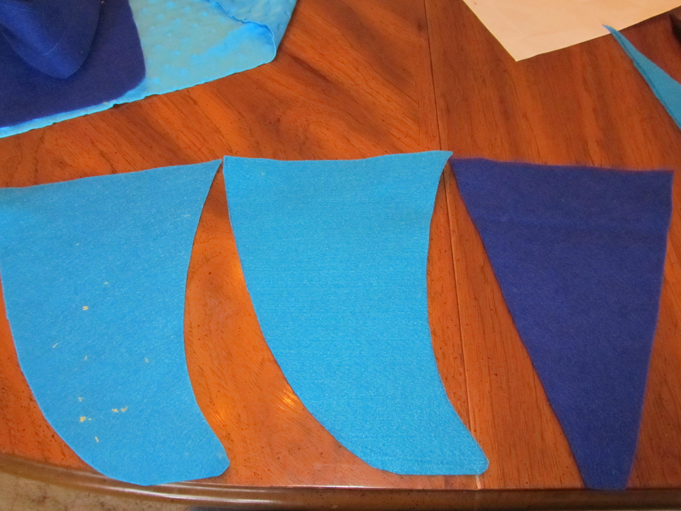 47 cut out tail shape and dark blue triangle with rounded tips.JPG