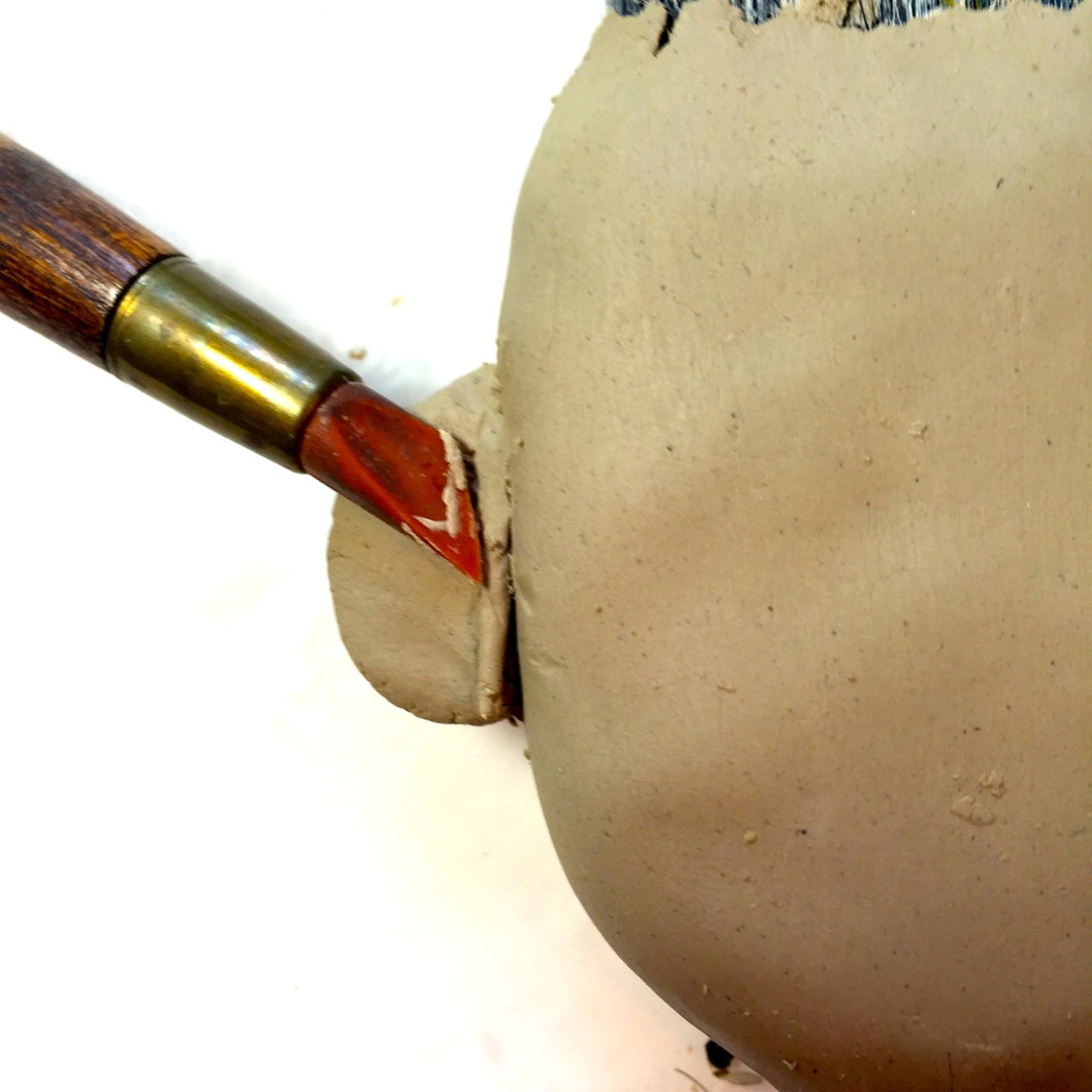 5  smoothing ear with clay tool.jpg