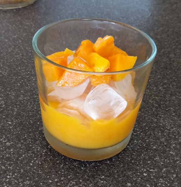 5-add mango chips into glass with mango paste-min.jpg