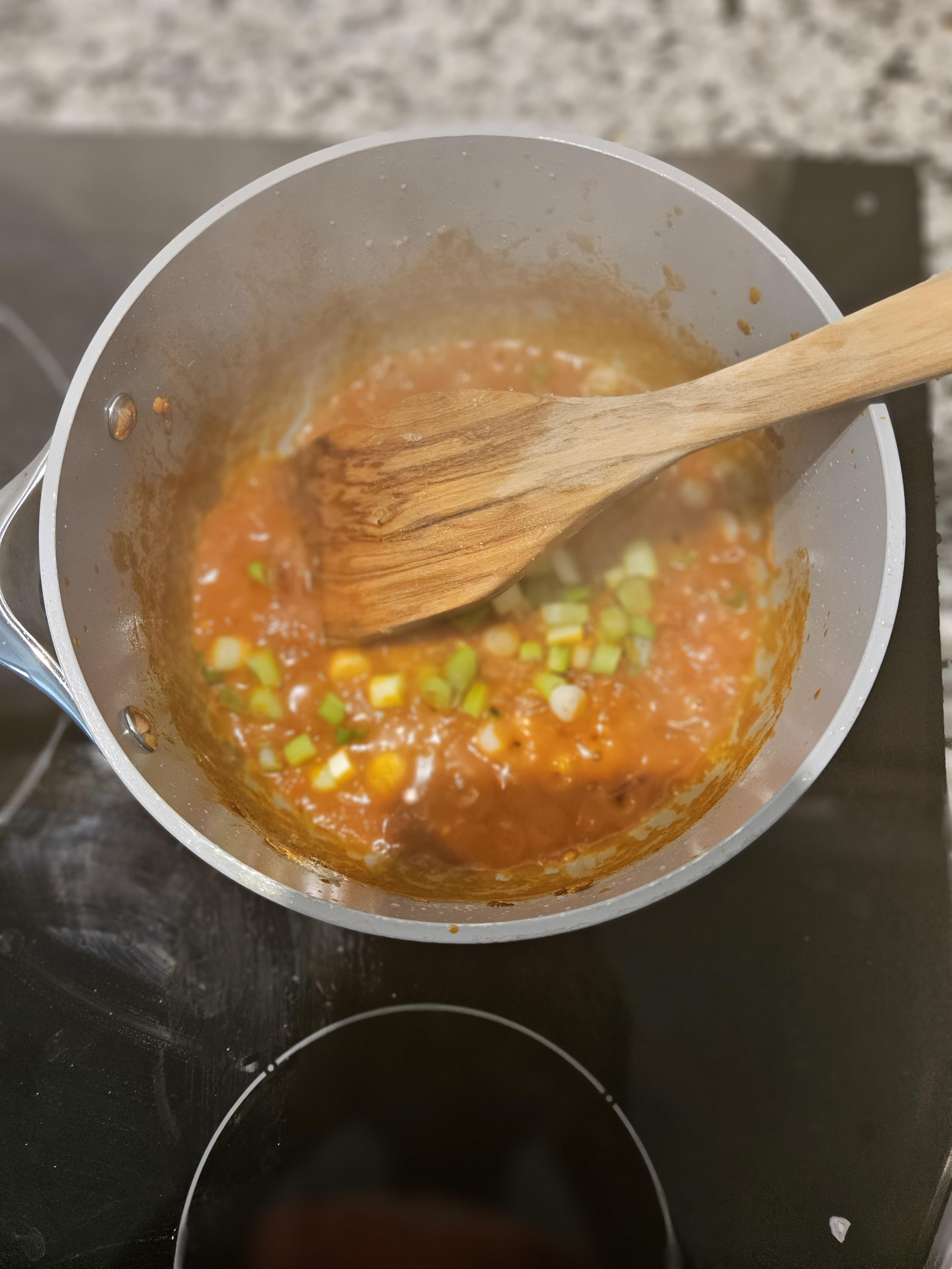 Added green onions and simmering.jpg