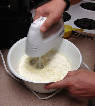 Adding Flour Mixture to Bowl.PNG