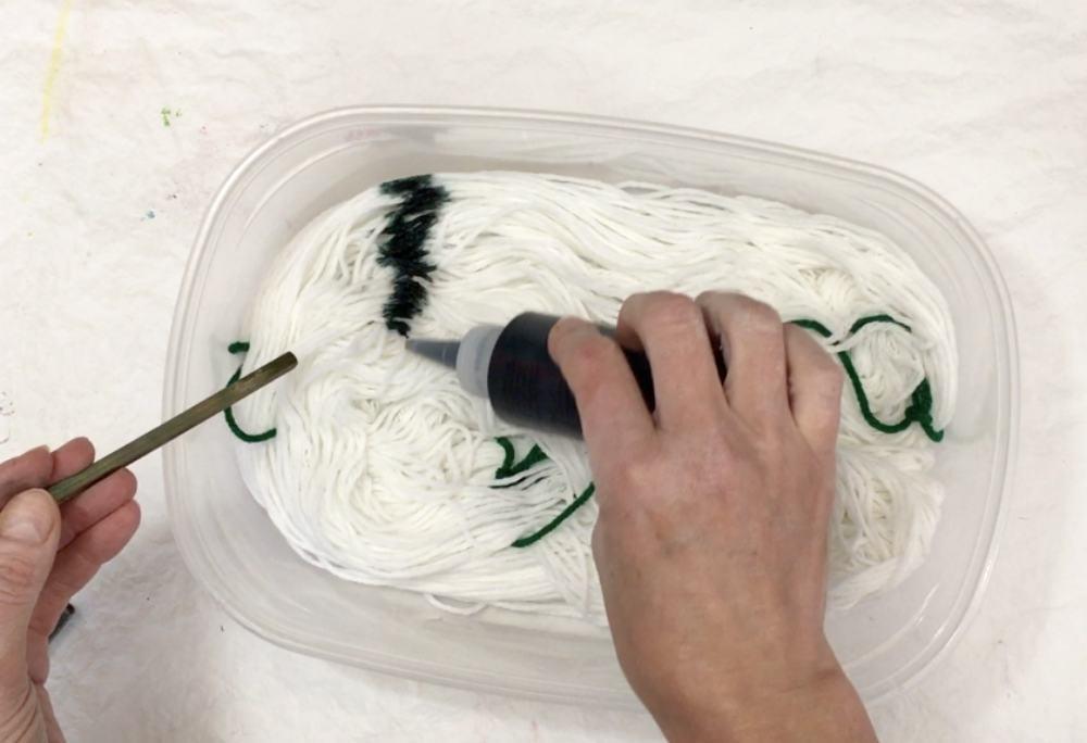 Applying the dye to the yarn.jpg