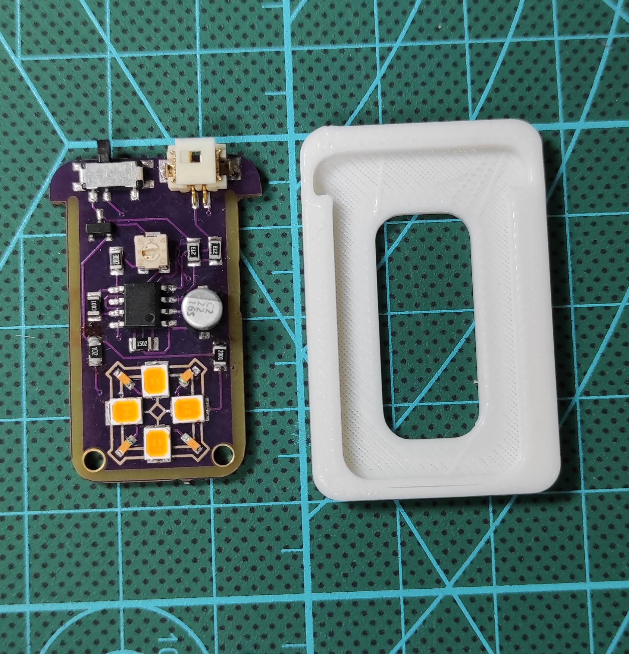 Assembled board and 3D printed housing.jpg