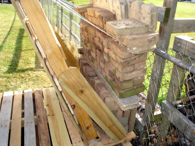 Backstop side view masonry safety wall.JPG