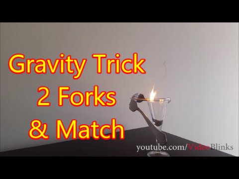 Balancing two forks on a toothpick or match