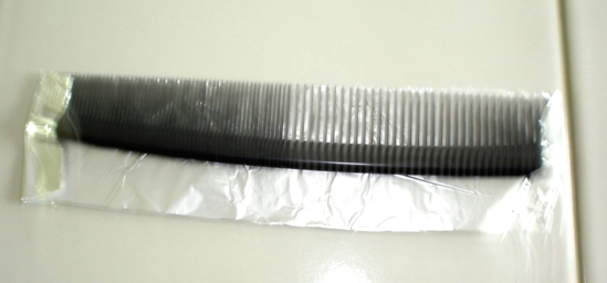 Bend foil over sides of comb.JPG