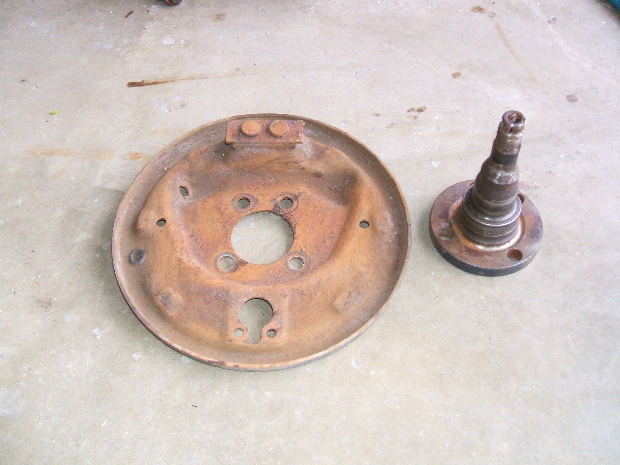 Brake backing plate and axle spindle.JPG