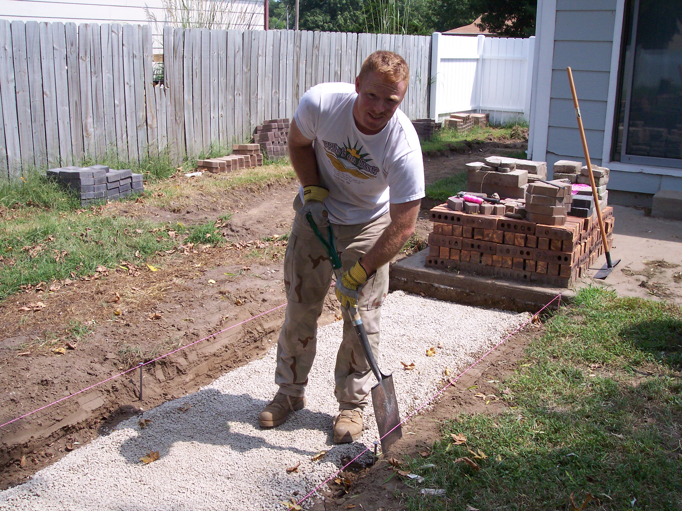 Brian moving rock September 1, 2008.JPG