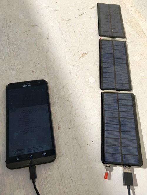 Charging-phone-from-solar-mobile-charger.jpg