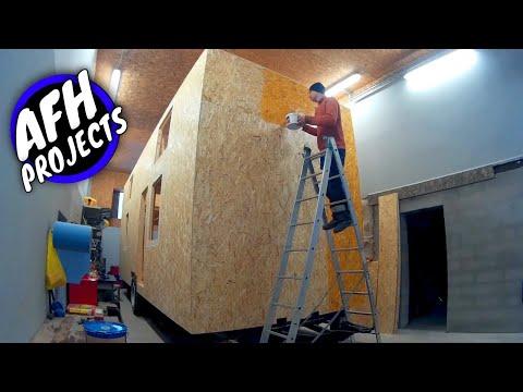 Cheap Tiny House on wheels build #4 - Installing windows, front door build, painted OSB facade