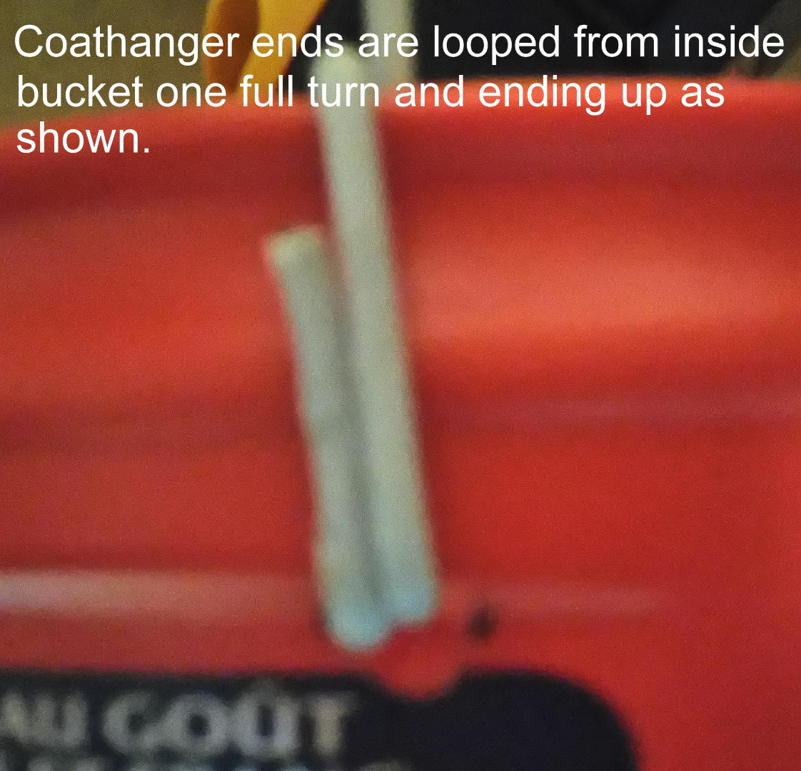 Coathanger ends are looped from inside bucket.jpg