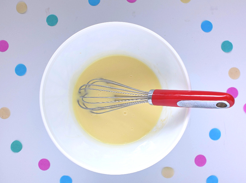 Condensed-milk-in-bowl-with-whisk.jpg