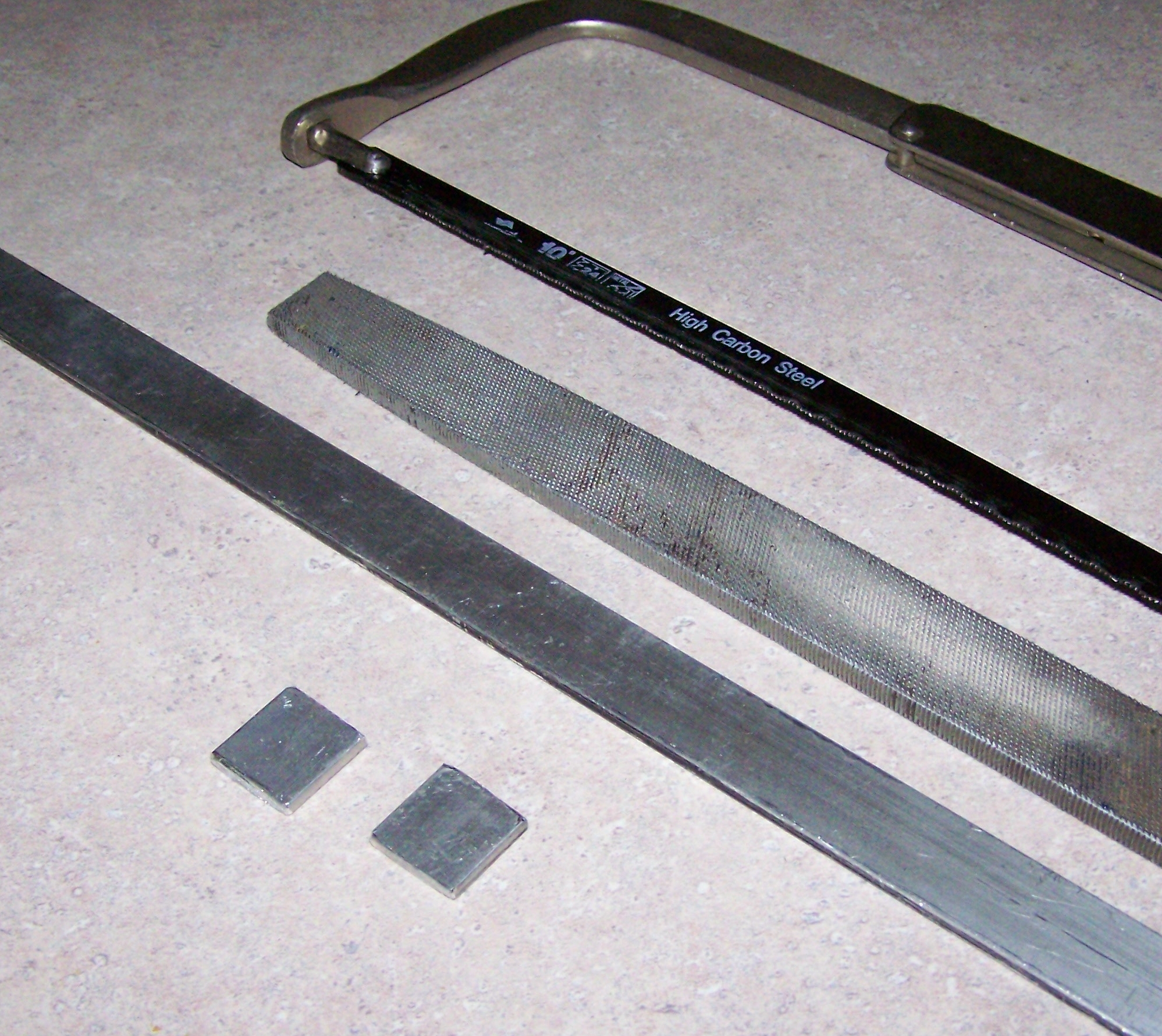 D alum bar stock and hacksaw.jpg