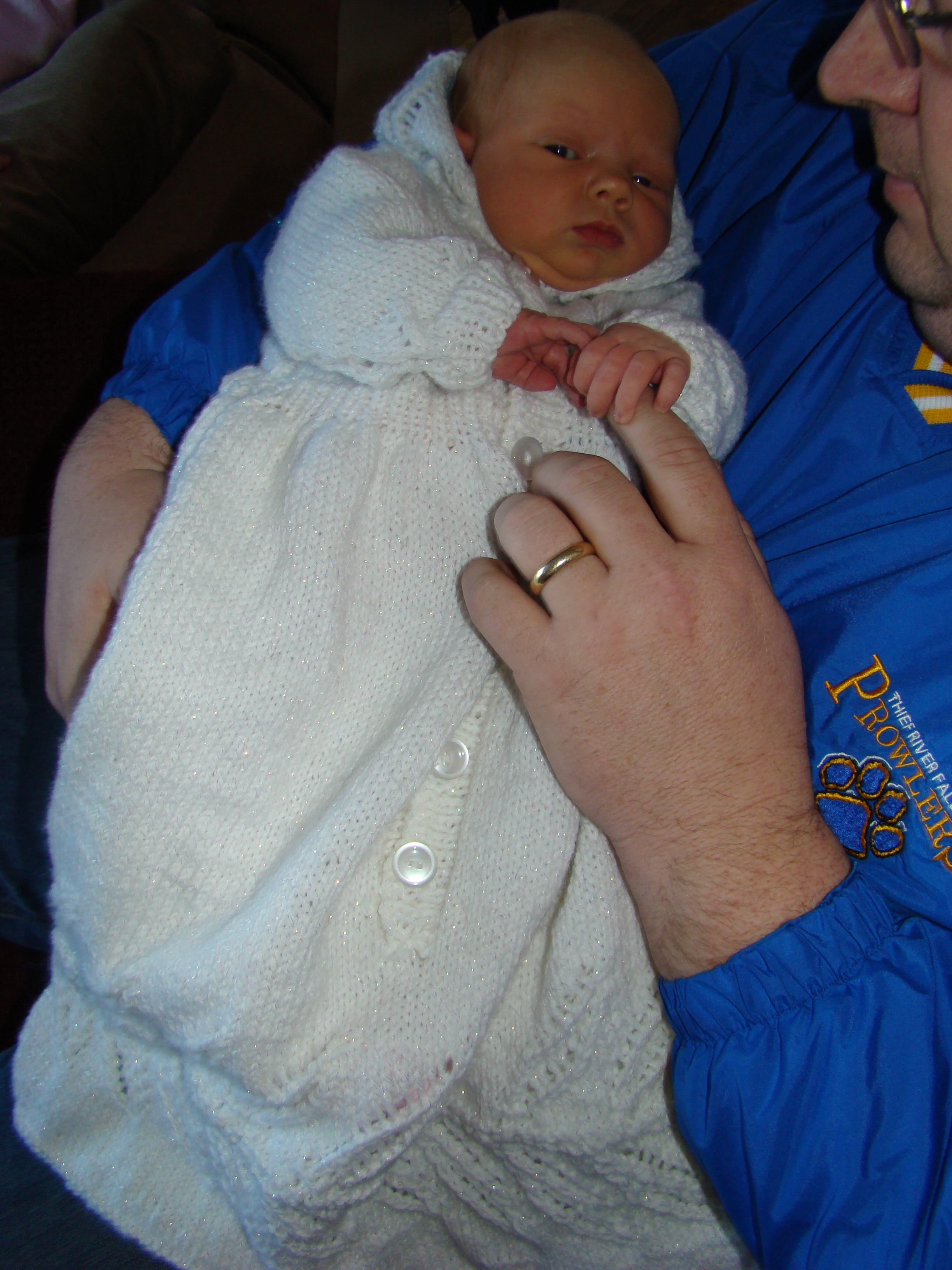 Daddy holding Baby Brenna (in her new Baptismal Gown!).jpg