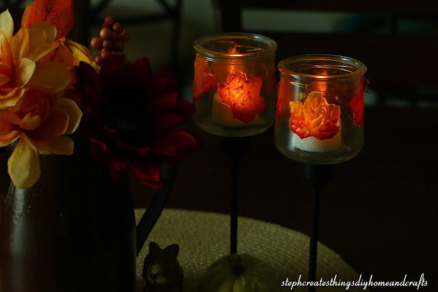 Decoupaged glass jars with leaves added to candle holder .jpg