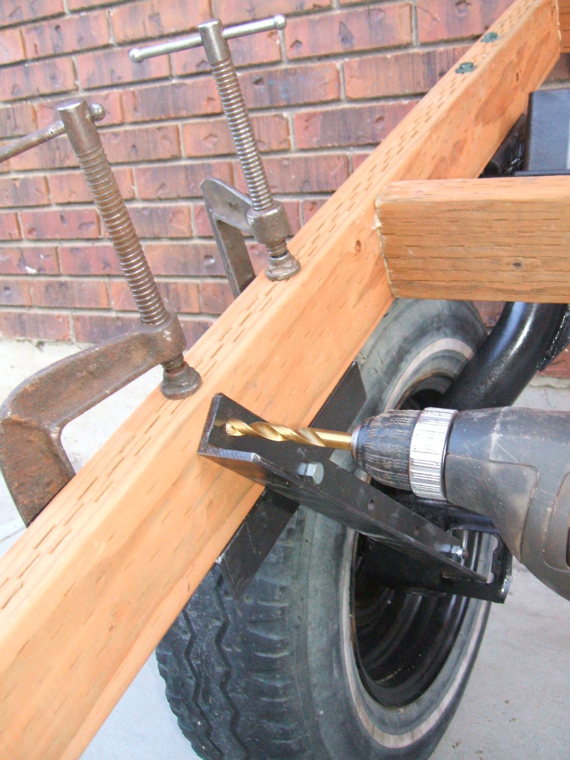 Drill hole in frame for front support.JPG