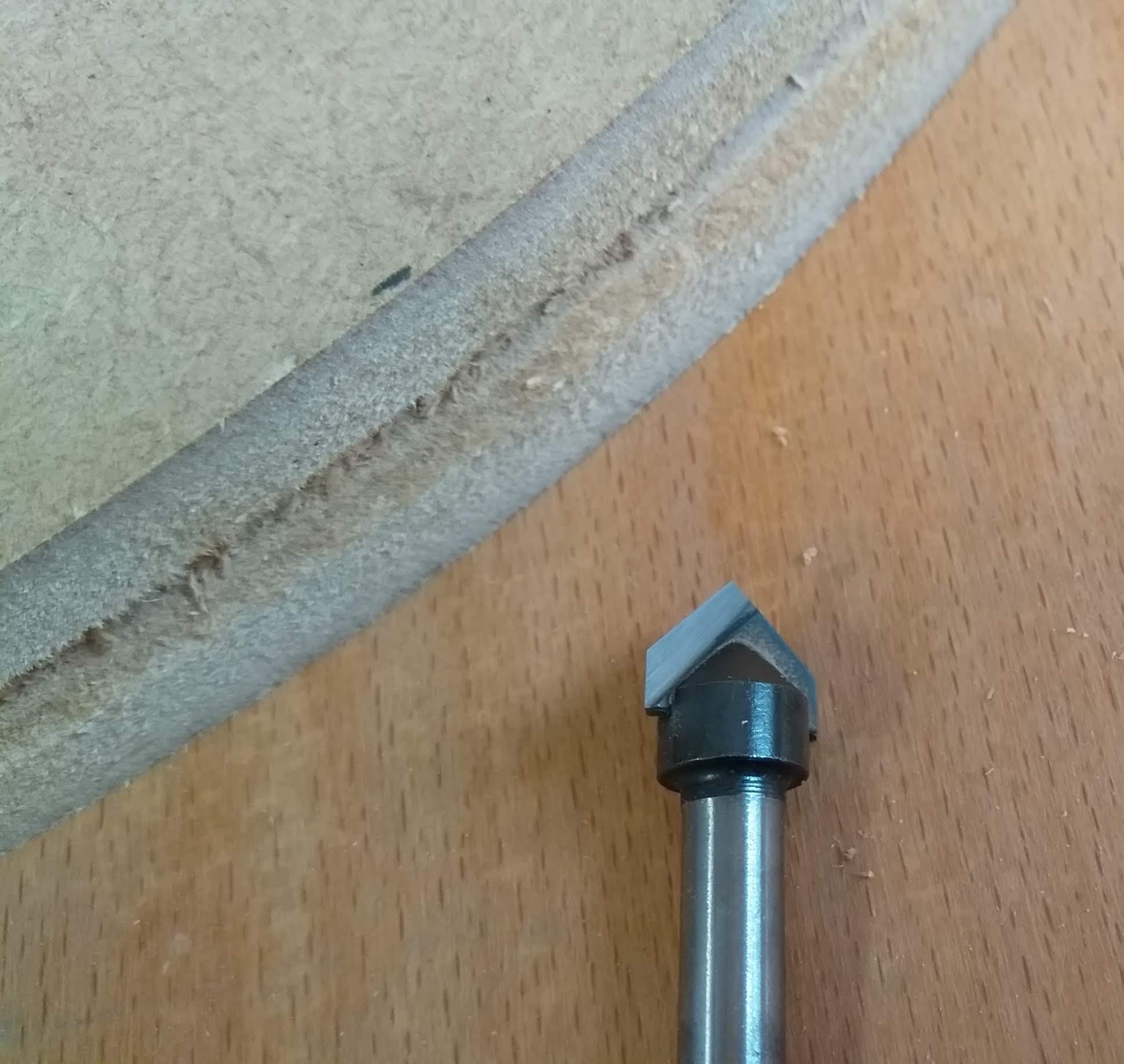 Edge of pipe former and router bit.jpg