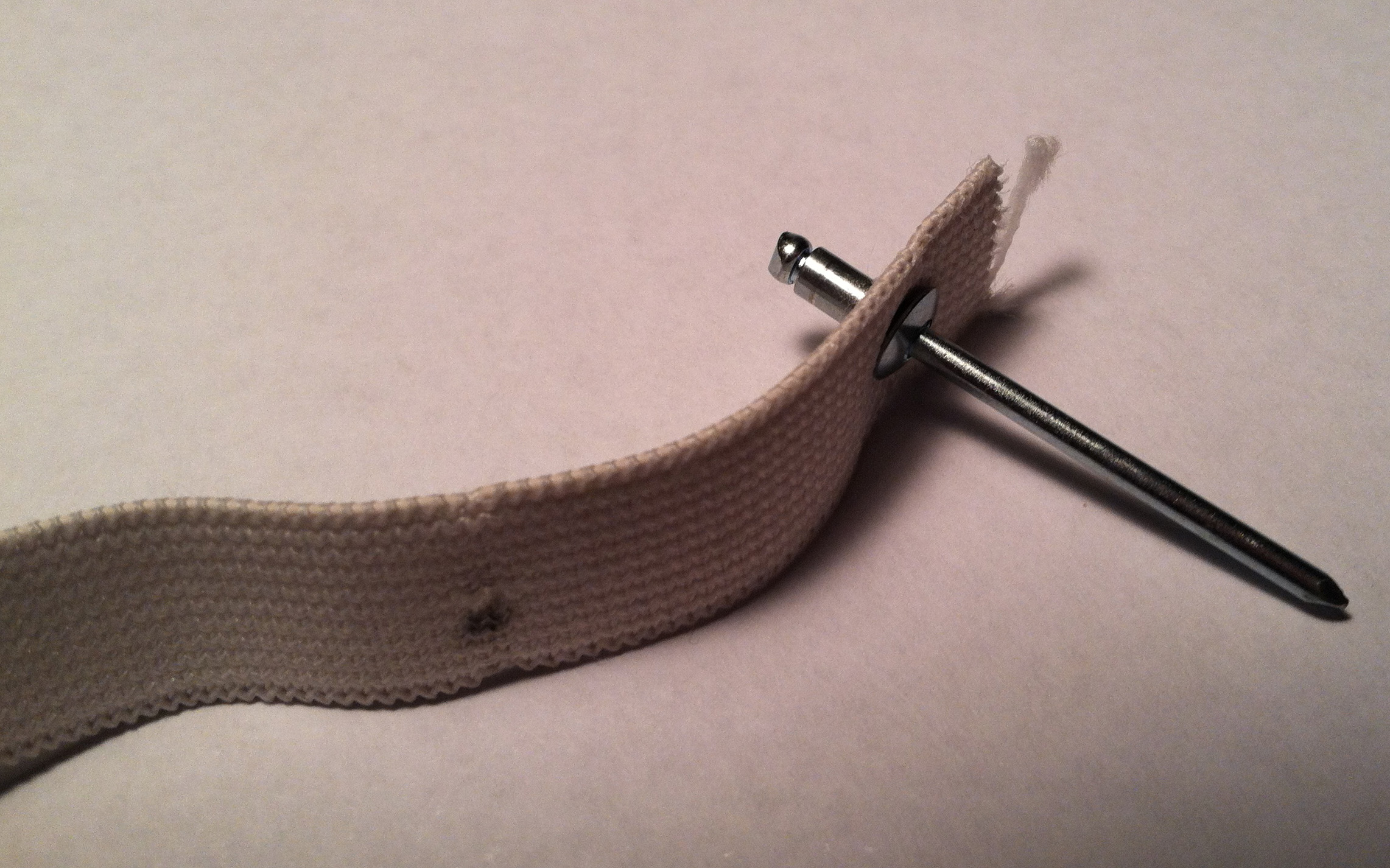 Elastic with Rivet.JPG