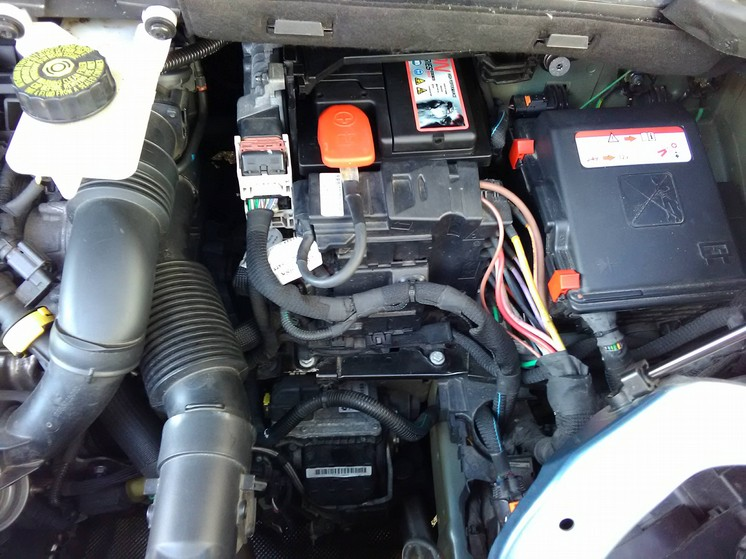 Engine compartment showing battery.png