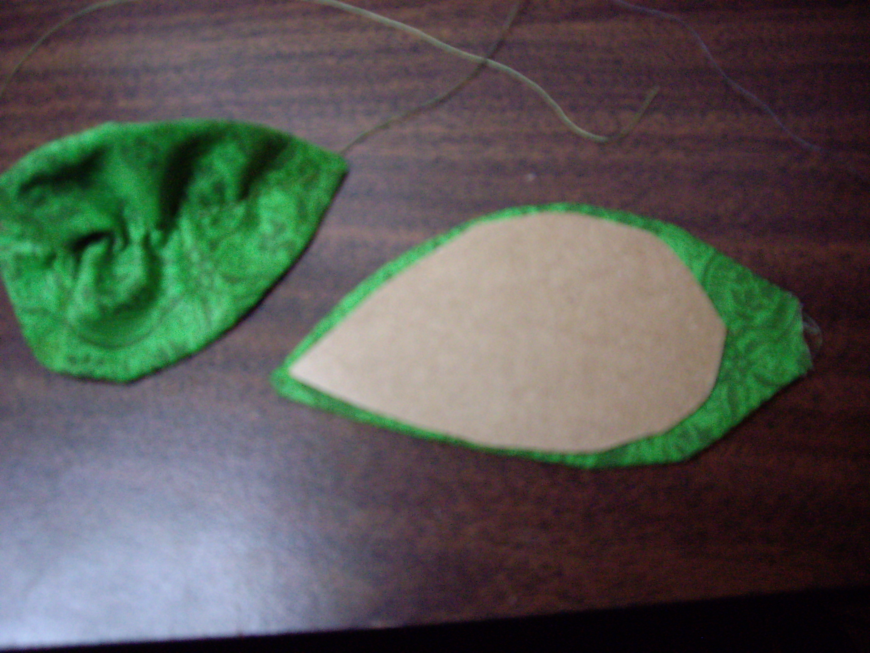 Finished Leaf and Pressed Leaf, under template.JPG