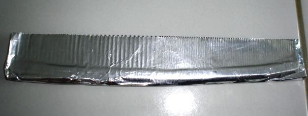 Flatten face of foil over comb teeth.JPG