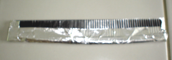 Fold bottom of foil up to secure to comb.JPG