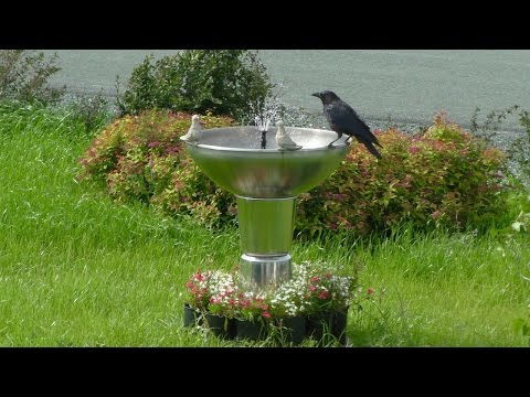 Fountain made from buckets and bowls has automatic water resupply