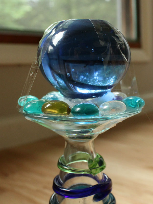 Glueing the blue glass ball to the wine glass.jpg