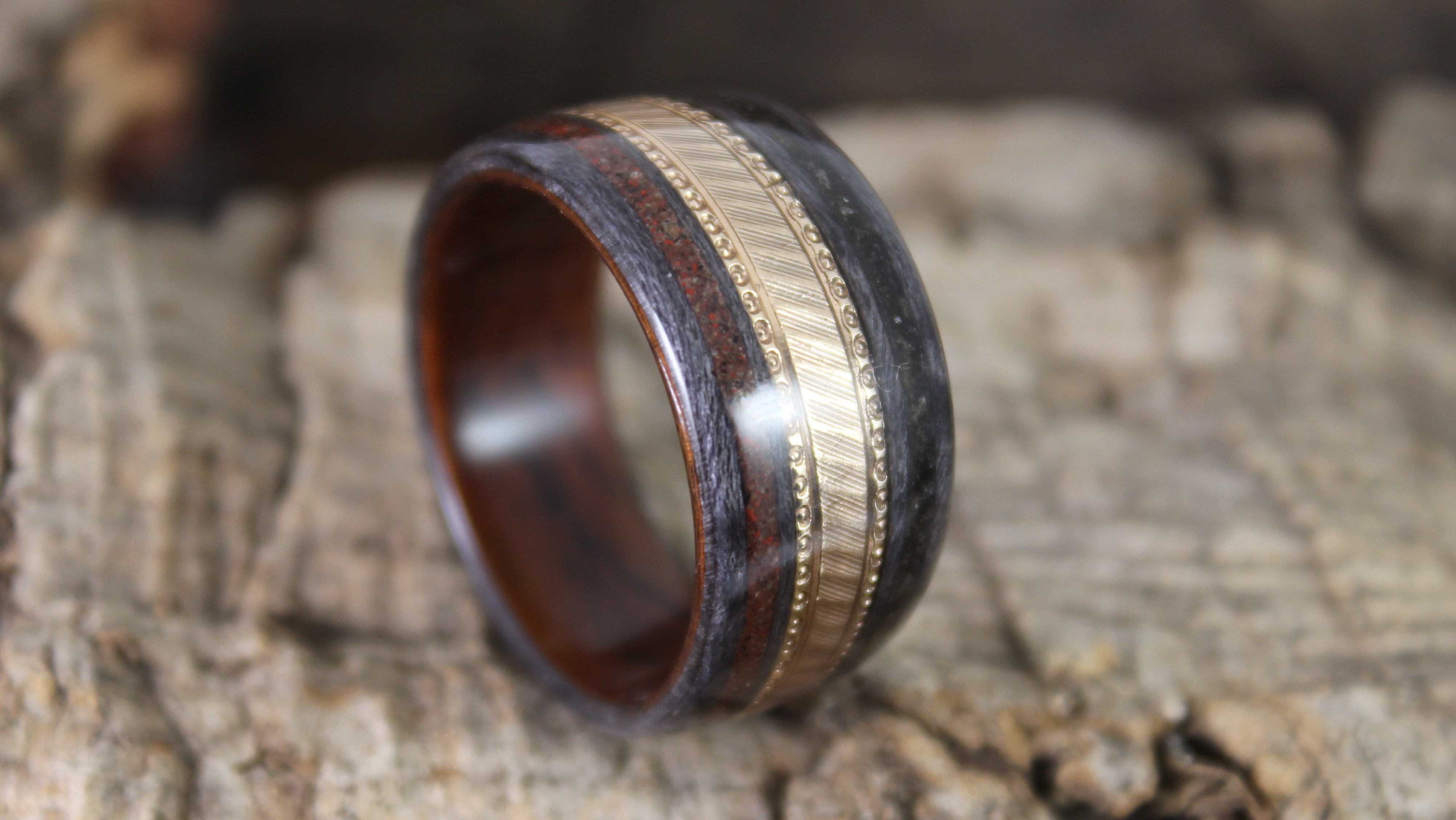 Gold Wedding Ring In A Wooden Ring Thumbnail.JPG