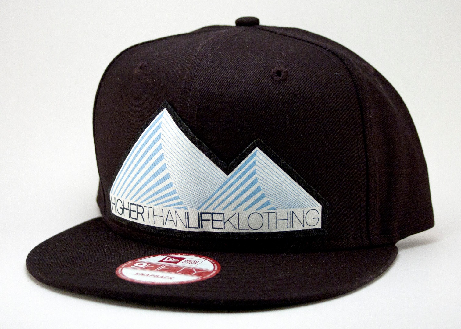 HTLK_Mountains_BlackBG_NEra_9Fifty_Black.jpg