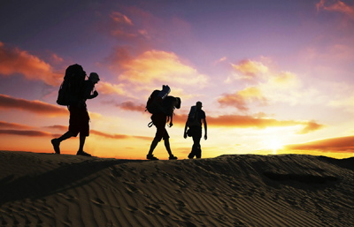 Hiking on sand at sunset.jpg