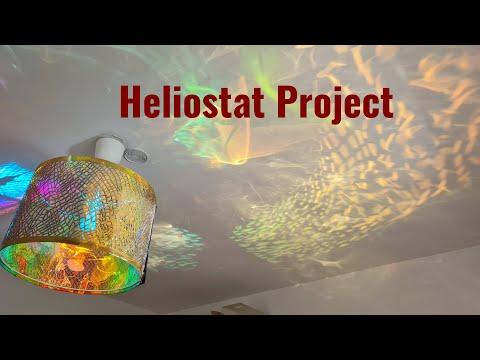 I built a heliostat which reflects the sunlight from the outside into a room.