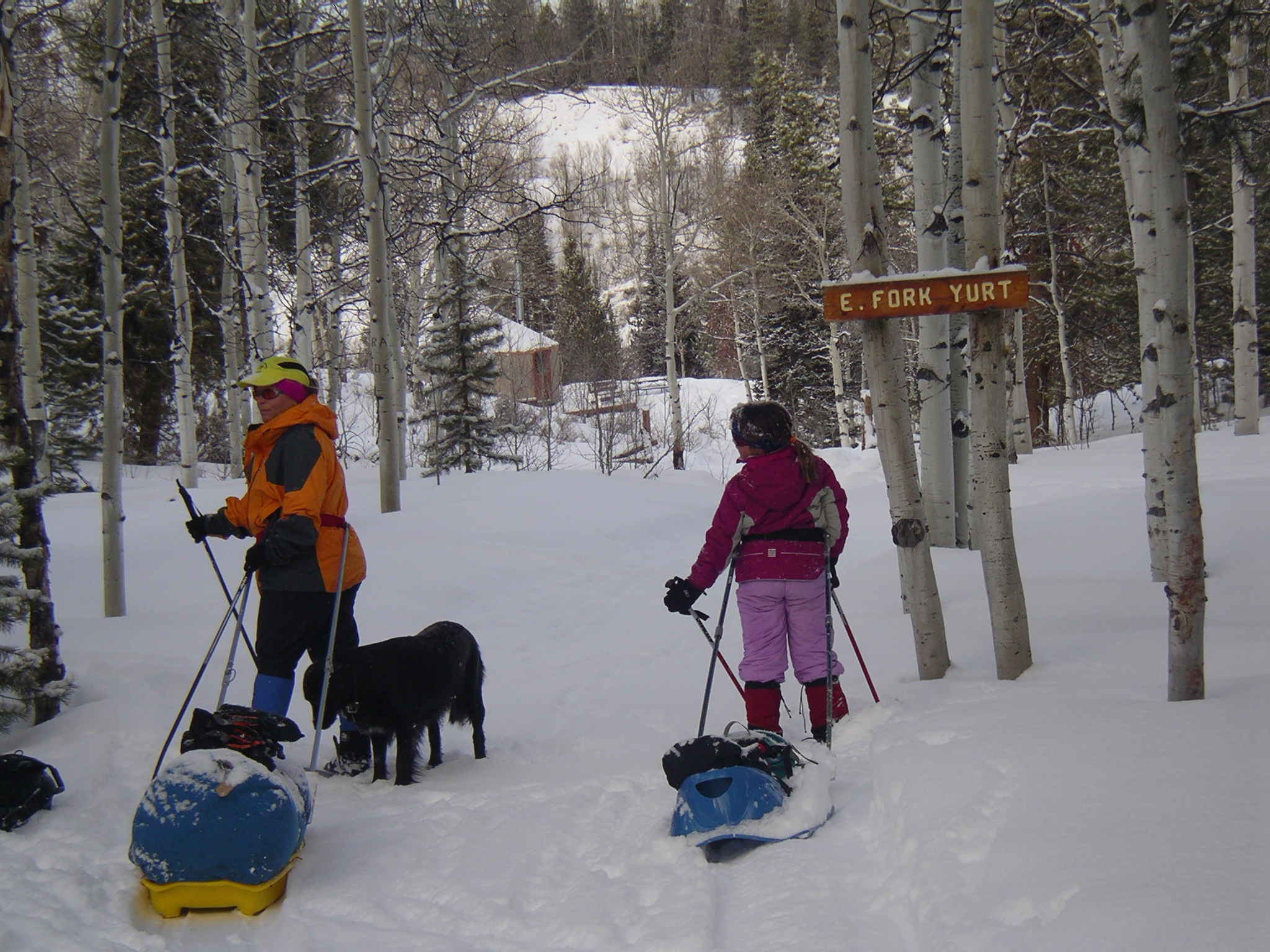 Mom and Brianna pulling sleds.JPG