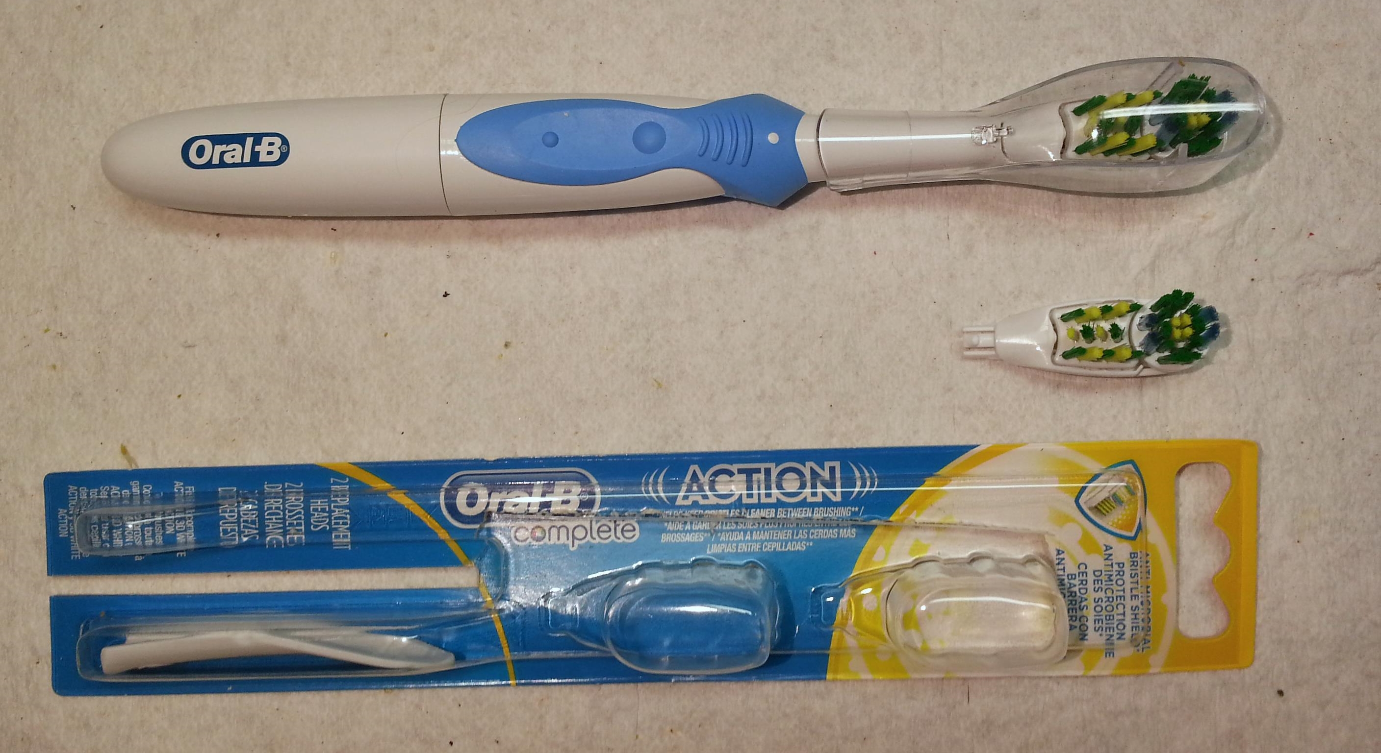 Oral action brush and package.jpg