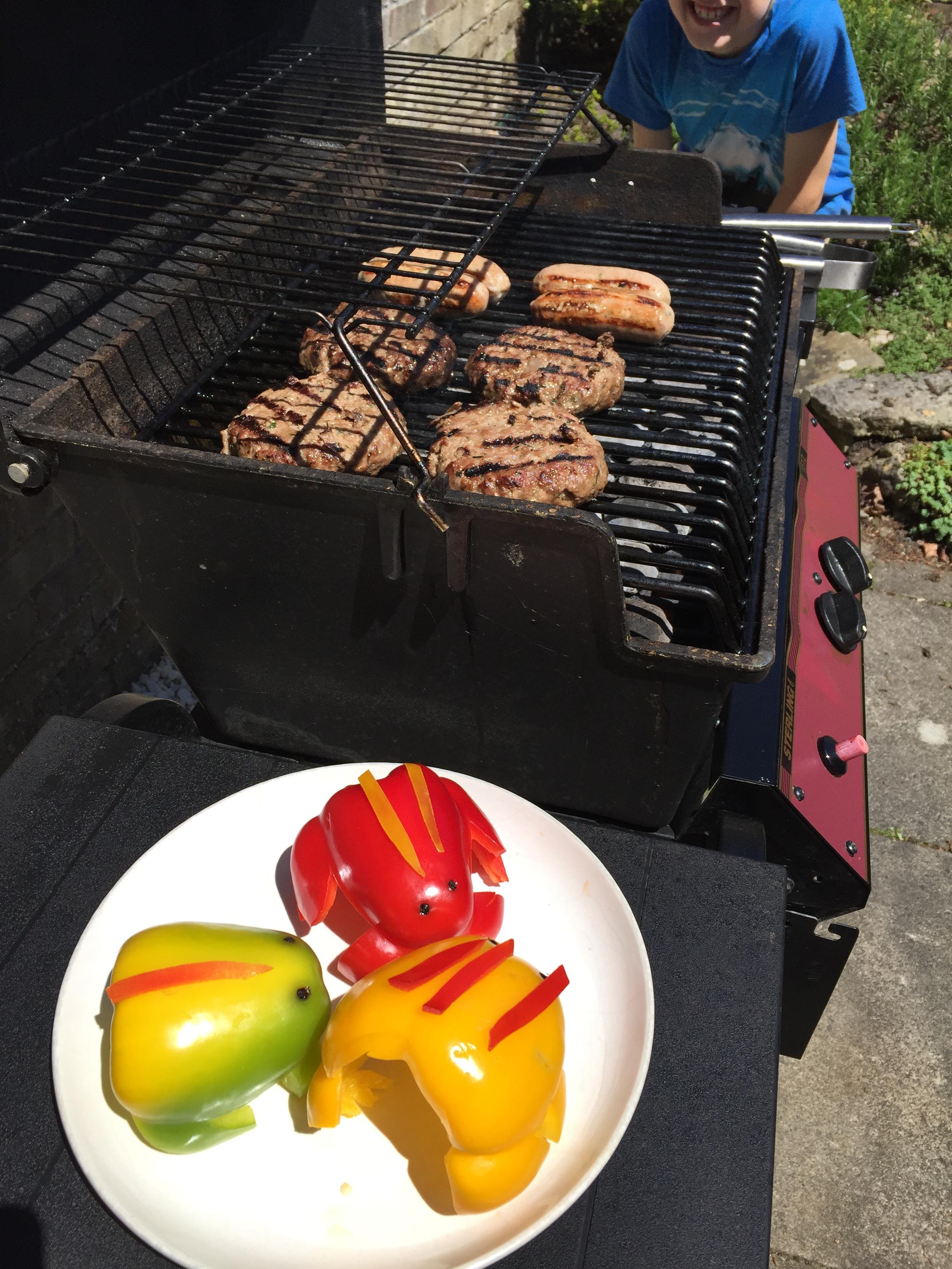 Pepper frogs nervously sitting by bbq.JPG